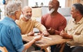 Senior men, friends and dominoes in board games on wooden table for activity, social bonding or gathering. Elderly group Royalty Free Stock Photo