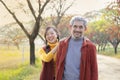 senior man with grey hair and beard enjoy walking with his daughter along the street Royalty Free Stock Photo