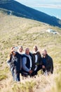 Senior, men and hiking selfie in nature, happy and relax, cheerful and smile on blue field background. Elderly, friends