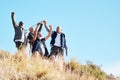 Senior, men and hiking success in nature, celebration and victory, cheering and happy on blue sky background. elderly