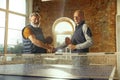 Senior men playing table tennis in workplace, having fun Royalty Free Stock Photo