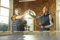 Senior men playing table tennis in workplace, having fun Royalty Free Stock Photo