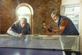 Senior men playing table tennis in workplace, having fun Royalty Free Stock Photo