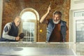 Senior men playing table tennis in workplace, having fun Royalty Free Stock Photo