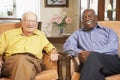 Senior men relaxing in armchairs Royalty Free Stock Photo