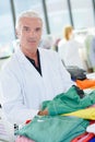 Senior man sorting laundry Royalty Free Stock Photo