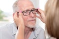 Senior man testing new eyeglasses Royalty Free Stock Photo