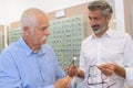 Senior man trying new eyeglasses on Royalty Free Stock Photo