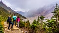 Seniors hiking on the moraines of the Victoria Glacier at Lake Louise, Banff National Park Royalty Free Stock Photo