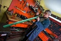 Metalworker in his garage, checking tools Royalty Free Stock Photo