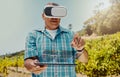 Senior mixed race farmer using virtual reality headset and digital tablet with cgi. Hispanic elderly man using