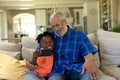 Senior mixed race man with his grandson taking a selfie Royalty Free Stock Photo