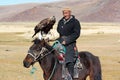 The senior Mongolian horseman with eagle Royalty Free Stock Photo