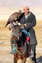 The senior Mongolian horseman with eagle Royalty Free Stock Photo