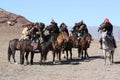 Senior Mongolians horsemen in traditional clothing