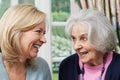 Senior Mother And Adult Daughter Talking Together