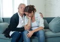 Mother and daughter crying at home in quarantine grieving loss of family members amid COVID-19 Royalty Free Stock Photo