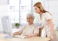 Senior mother and daughter using computer Royalty Free Stock Photo