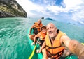 Senior mother and father with son taking selfie at kayak excursion in Thailand - Adventure travel in south east asia Royalty Free Stock Photo