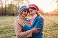 Senior mother and her adult daughter hugging in spring forest. Mother`s day concept. Family values Royalty Free Stock Photo