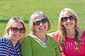 A senior mother with her adult daughters