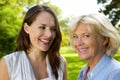 Senior mother smiling with older daughter