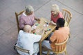 Senior Multiethnic Friends Playing Cards Together Royalty Free Stock Photo