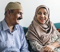 Senior Muslim couple at home