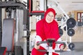 Senior muslim woman doing workout on exercise bike Royalty Free Stock Photo