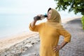 Senior muslim woman drink water
