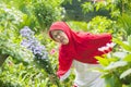 Senior muslim woman getting backache at garden