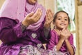 Senior Muslim woman and her granddaughter saying prayers Royalty Free Stock Photo