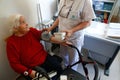 Senior with nurse on daily blood pressure control a nursing home in Mallorca Royalty Free Stock Photo