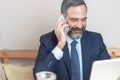 Elderly business man in a coffee shop Royalty Free Stock Photo