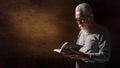 Senior old christian man holding and reading holy bible book Royalty Free Stock Photo