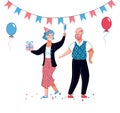 Senior old couple at birthday celebration with party hat, balloons, gift box Royalty Free Stock Photo