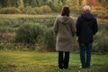 Senior old couple walking in the park forest lifestyle love sport watching sunset