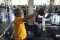 Senior old man dumbbell exercise in gym