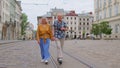 Senior old stylish tourists man, woman, grandmother, grandfather family having a walk in summer city Royalty Free Stock Photo