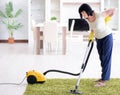 Senior old woman tired after vacuum cleaning house Royalty Free Stock Photo