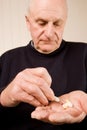 Senior older man taking a tablet or pill Royalty Free Stock Photo