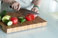 Senior or older woman cooking salad in kitchen. Healthy food concept. Healthy lifestyle. Grandma prepares a healthy meal for her Royalty Free Stock Photo