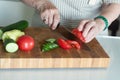 Senior or older woman cooking salad in kitchen. Healthy food concept. Healthy lifestyle. Grandma prepares a healthy meal for her Royalty Free Stock Photo