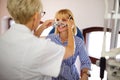 Optometrist examining patient in modern ophthalmology clinic Royalty Free Stock Photo