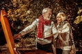 Senior painter showing a new picture to his wife.