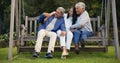 Senior parents, hug or woman on bench with laughing, nature or bonding with goofy on retirement. Mature man, mother or Royalty Free Stock Photo