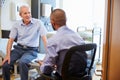 Senior Patient And Doctor Have Consultation In Hospital Room Royalty Free Stock Photo