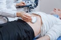 Senior patient getting ultrasound scanning of abdomen in the clinic Royalty Free Stock Photo