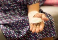 Senior patient hand with bandage from stretch