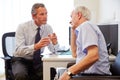 Senior Patient Having Consultation With Doctor In Office Royalty Free Stock Photo